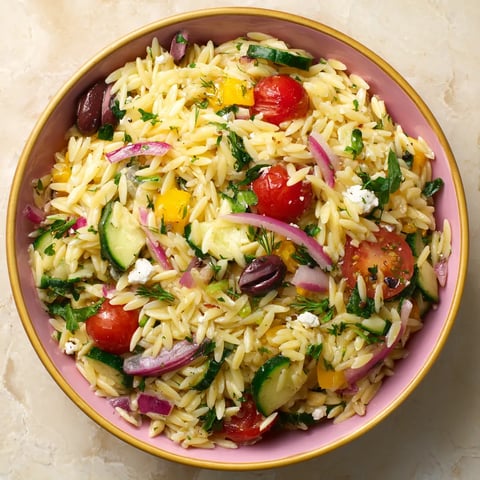 A bowl of rice with vegetables.