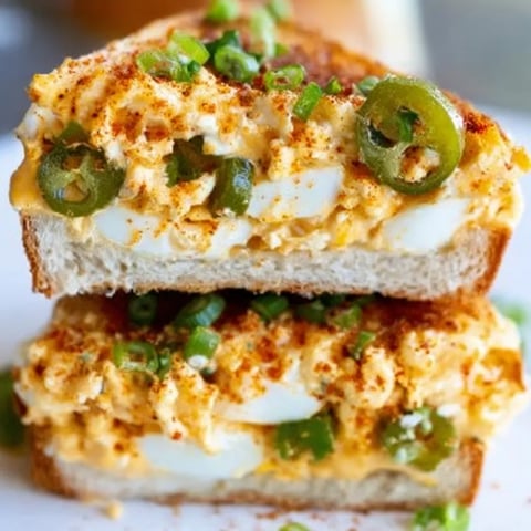A sandwich with peppers and cheese.