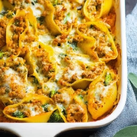 A dish of food with a green leaf on top.